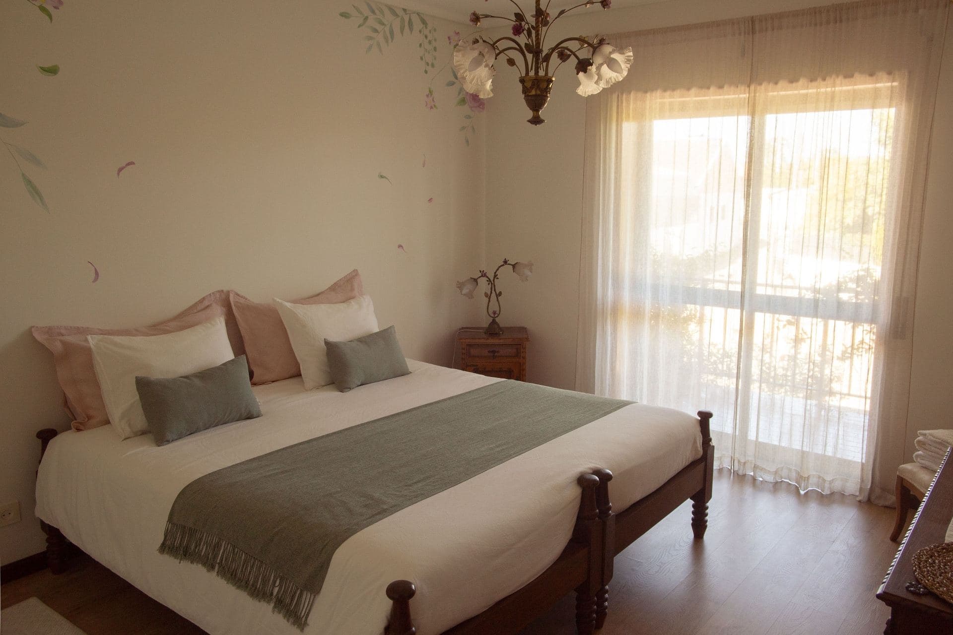 Serene bedroom with hand-painted floral mural